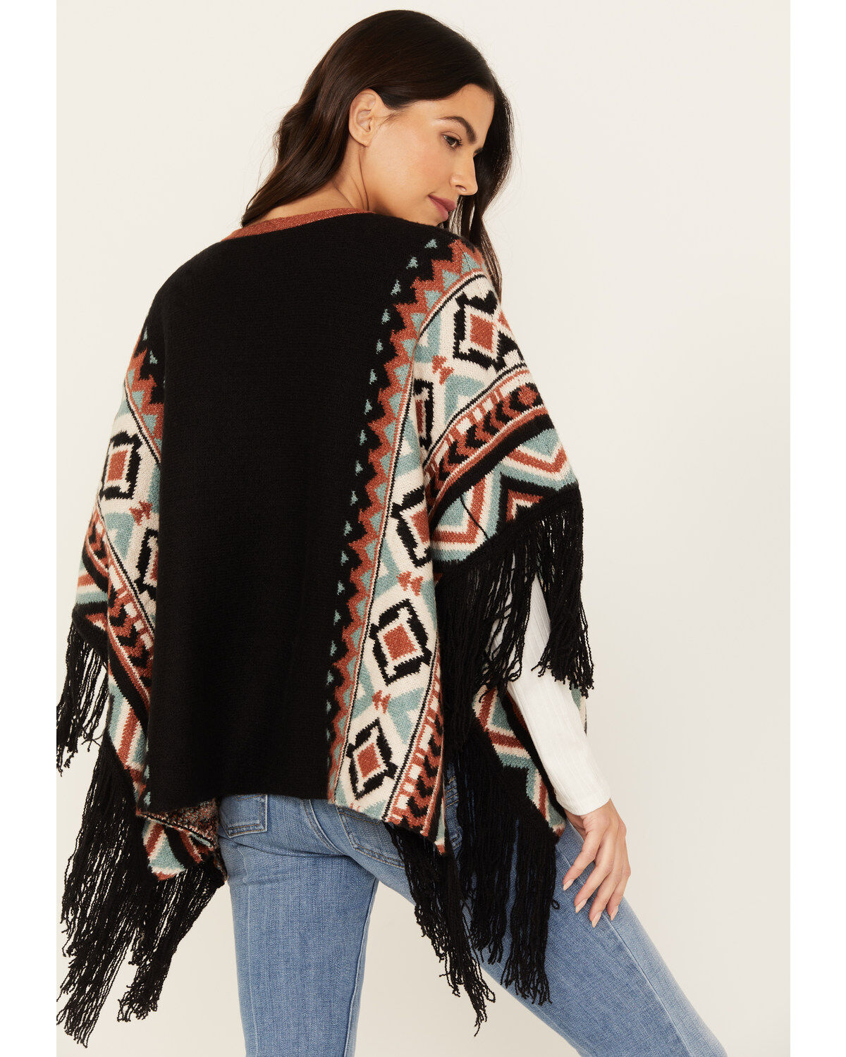I remember having so many of these knitted ponchos in all