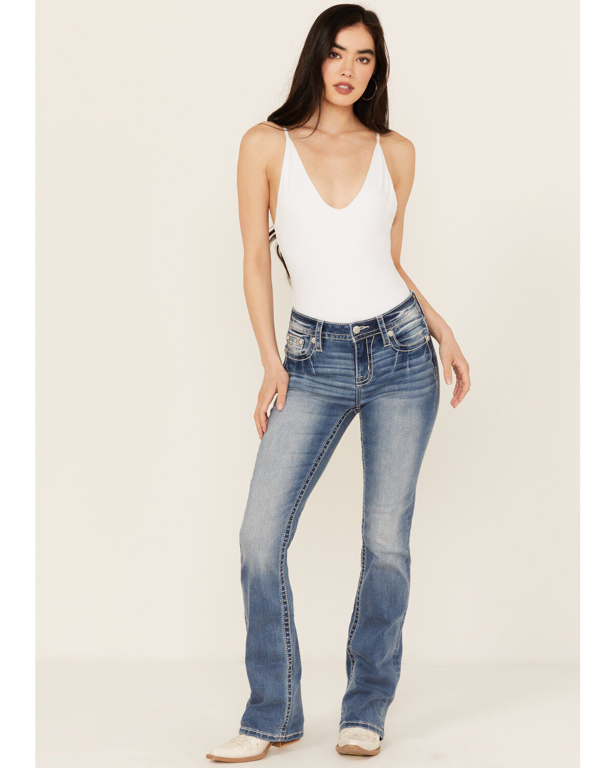 Product Name:  Miss Me Women's Fleur de Lis Medium Wash Mid Rise Bootcut Stretch Denim Jeans