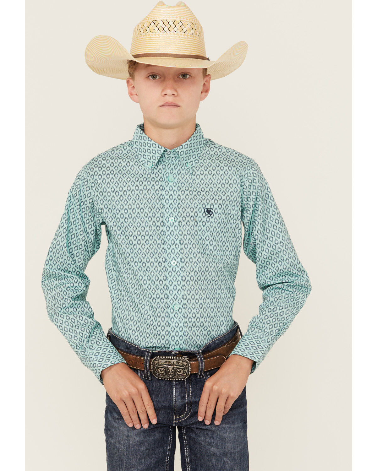 The product is a teal shirt, but it is a button-down style rather than a stretch shirt, which slightly reduces its relevance to the keyword.