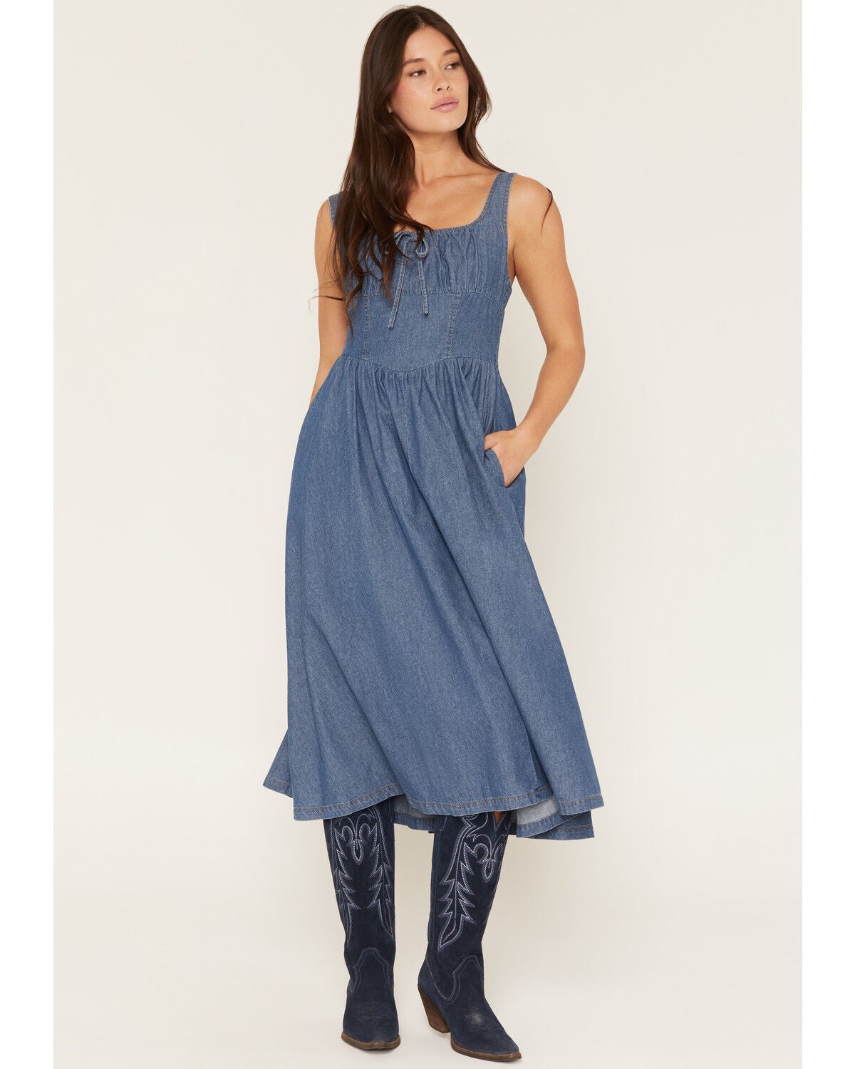 The product is a denim corset dress, which directly matches the keyword 'denim corsets'.