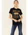 Image #1 - Kerusso Women's Heroes Ride Off Into The West Graphic Short Sleeve Tee, Black, hi-res