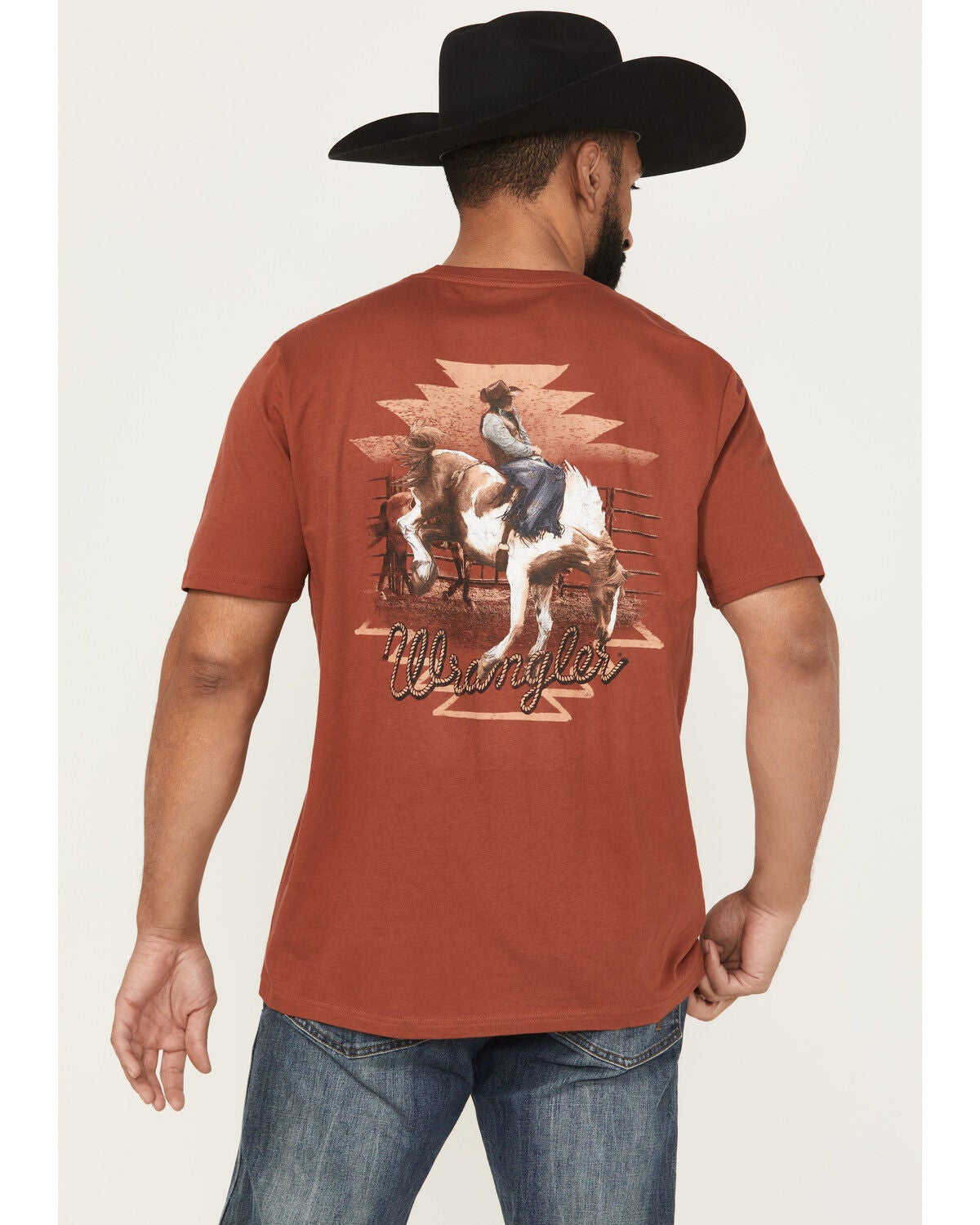 Wrangler Men's Boot Barn Exclusive Bucking Bronco Short Sleeve Graphic Tee, Rust Copper, hi-res
