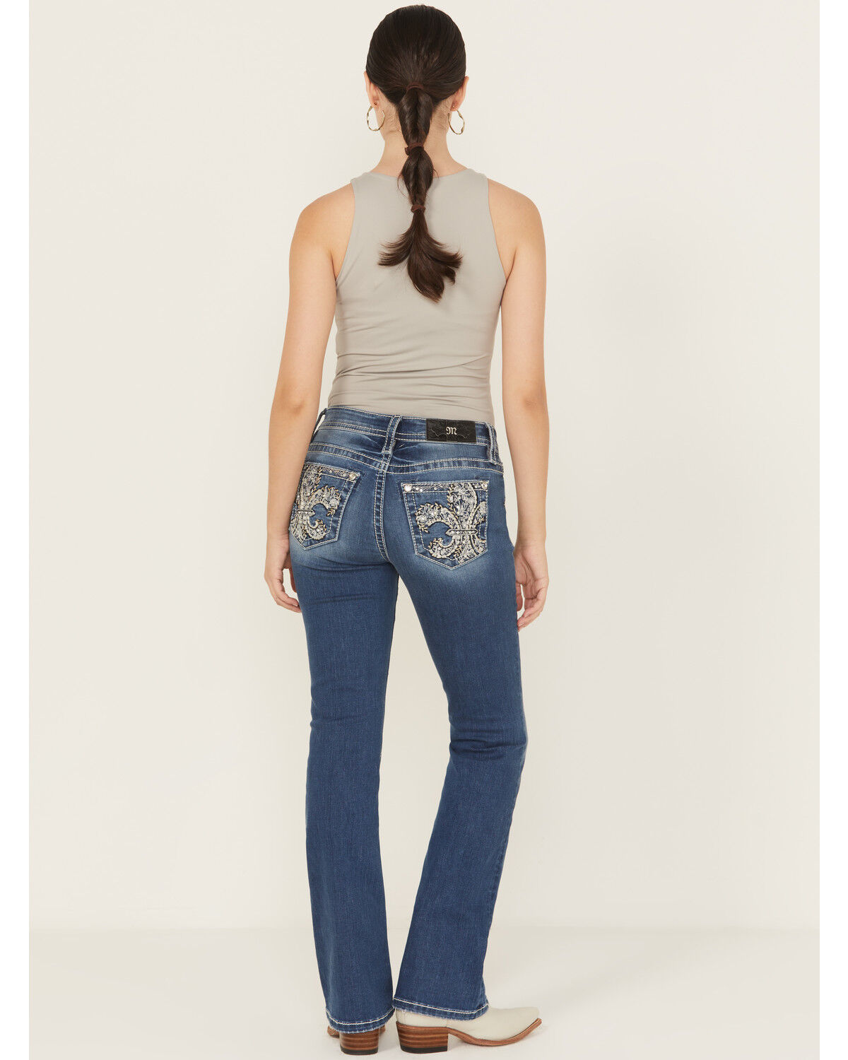 Image #1 - Miss Me Women's Medium Wash Mid Rise Fleur de Lis Pocket 32" Bootcut Stretch Denim Jeans, Medium Wash, hi-res