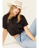 Image #1 - Cleo + Wolf Women's Living Free Graphic Drawcord Crop Tee, Black, hi-res