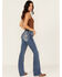 Image #1 - Miss Me Women's Medium Wash Mid Rise Fleur de Lis Pocket 34" Bootcut Stretch Denim Jeans, Medium Wash, hi-res