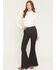 Image #1 - Wrangler X Lainey Wilson Women's Slim Fit High Rise Pull-On Stretch Bell Bottom Jeans, Black, hi-res