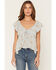 Image #1 - Wild Moss Women's Floral Print Hanky Hem Short Sleeve Top, Light Blue, hi-res