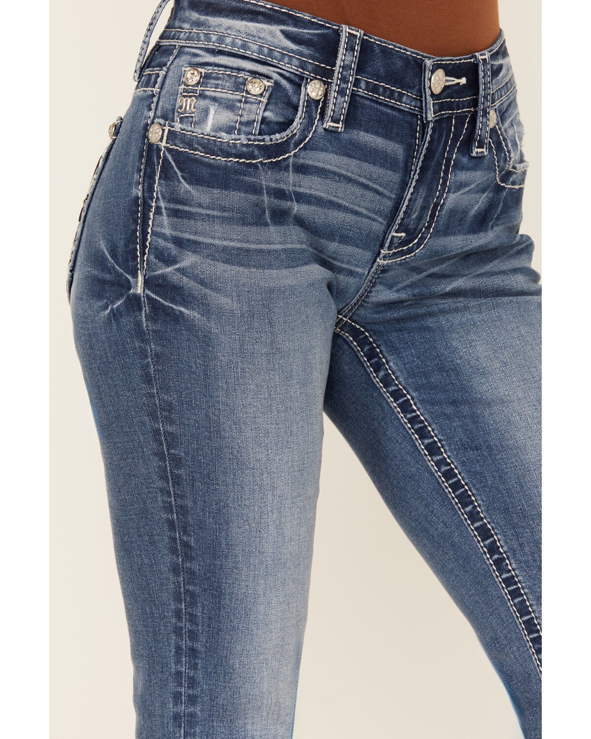 Product Name:  Miss Me Women's Medium Wash Mid Rise Fleur de Lis Pocket Bootcut Stretch Denim Jeans