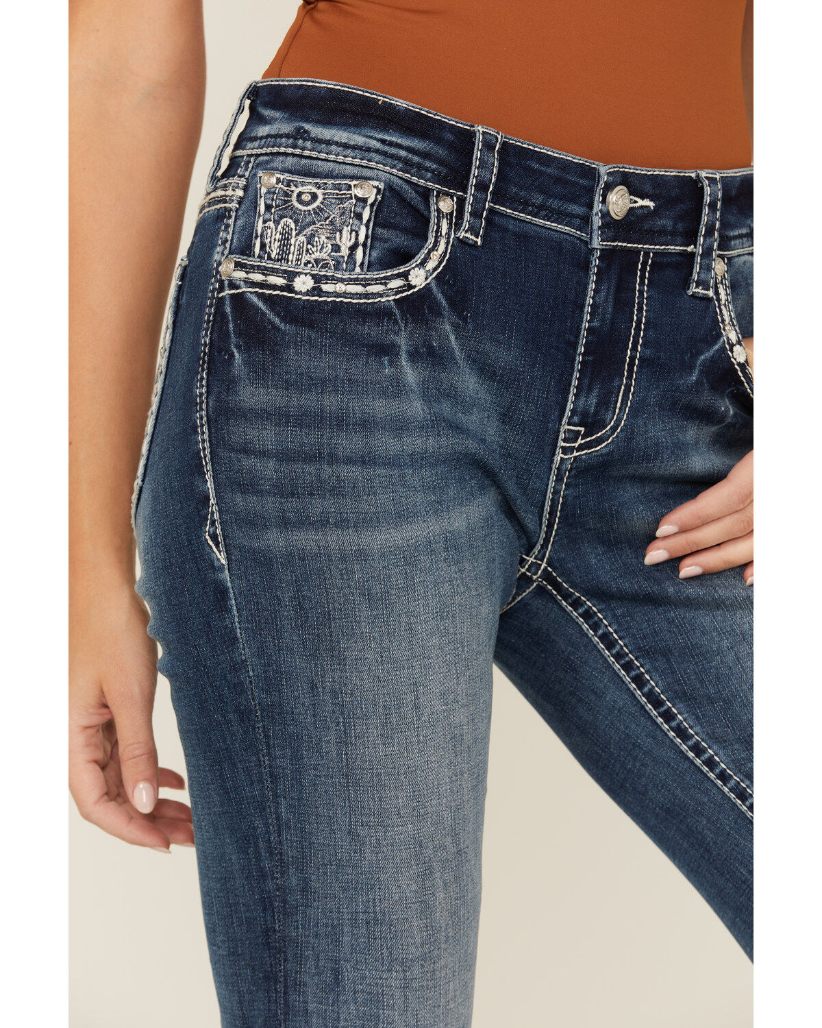 Product Name:  Grace in LA Women's Medium Wash Mid Rise Cow Skull and Horseshoe Pocket Bootcut Denim Jeans
