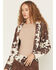 Image #1 - Shyanne Women's Porter Cow Print Faux Suede Embellished Fringe Moto Jacket, Brown, hi-res