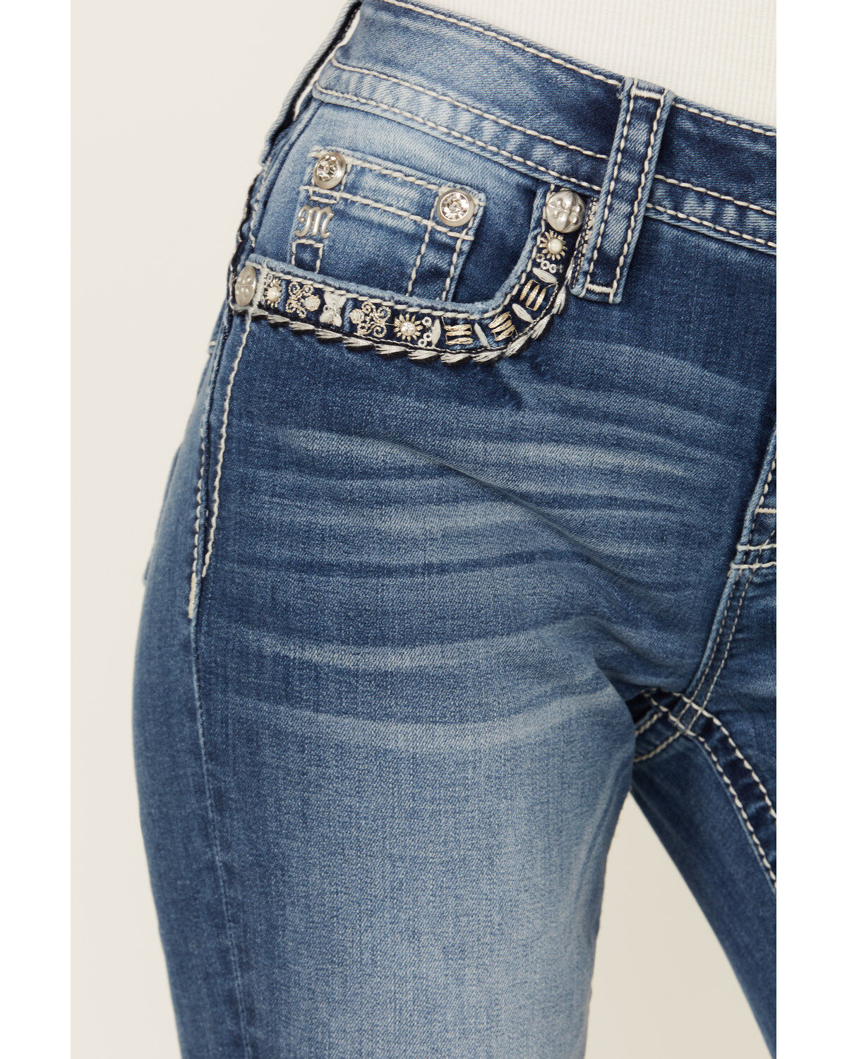 Product Name:  Miss Me Women's Medium Wash Mid Rise Border Flap Pocket Bootcut Stretch Denim Jeans
